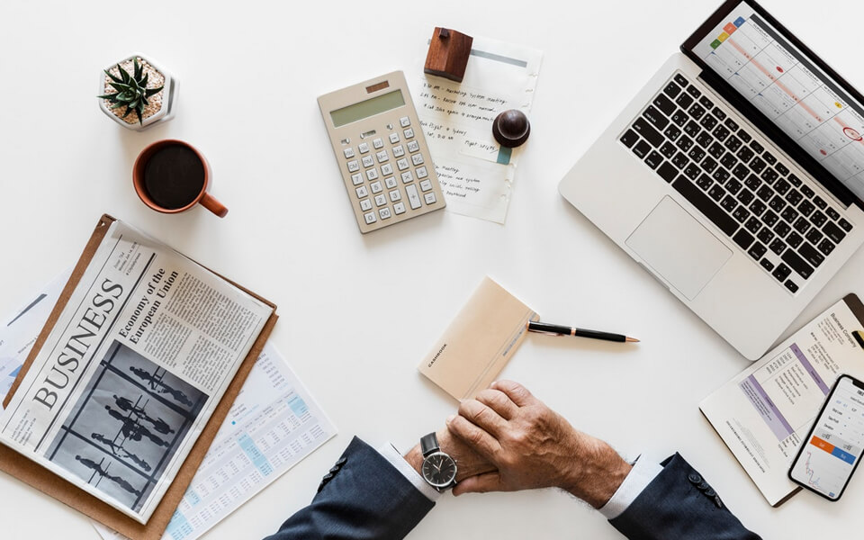 Business planning workspace with documents and devices