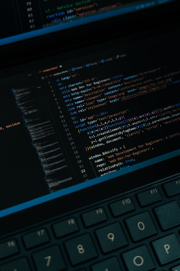 Software development workspace with code on a screen